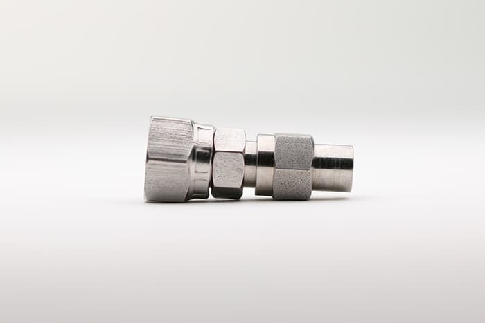 A single paint hose fitting without a spring guard