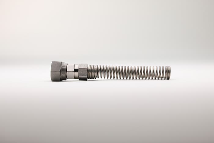 A single paint hose fitting with a spring guard